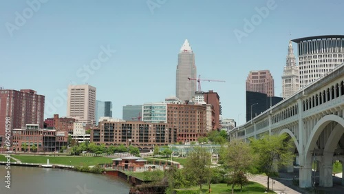 Cleveland Ohio downtown skyline park 4K drone dolly backwards low