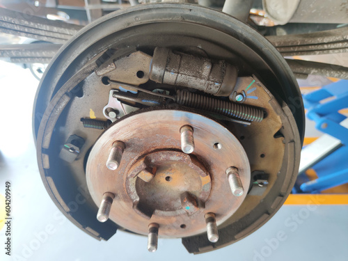 rusty car drum brake without cover hub, maintenance brake system at car auto garage shop
