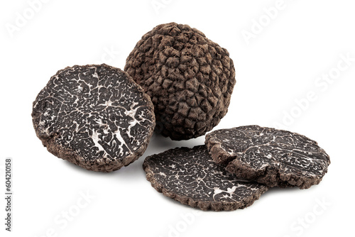 black truffles with slices on white background. photo
