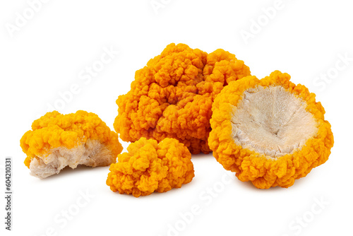fresh golden ear mushroom or tremella mesenterica (yellow brain fungus) isolated on white background. photo