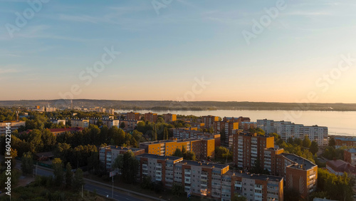Russia  Votkinsk. Embankment with a dam and factories. Votkinsk is a city in the Udmurt Republic. Sunset time  Aerial View