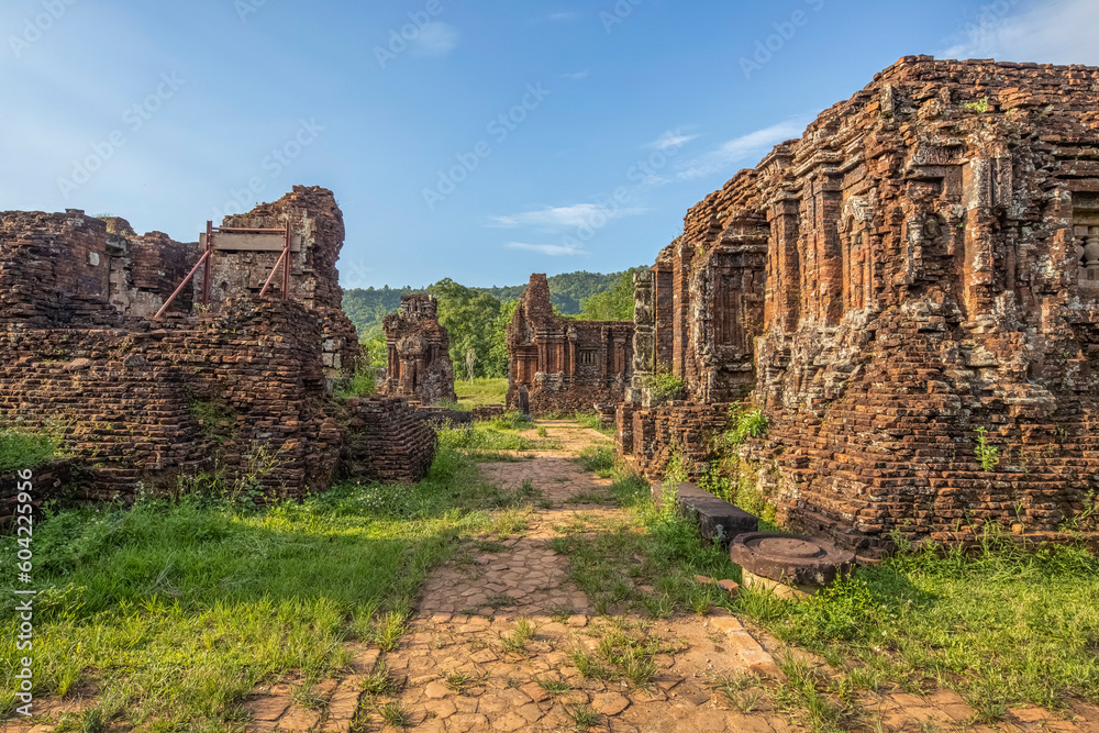 Fototapeta premium MY SON SANCTUARY IS A LARGE COMPLEX OF RELIGIOUS RELICS COMPRISES CHAM ARCHITECTURAL WORKS. A UNESCO WORLD HERITAGE SITE IN QUANG NAM, VIETNAM. LOCATED ABOUT 30 KM WEST OF HOI AN ANCIENT TOWN.