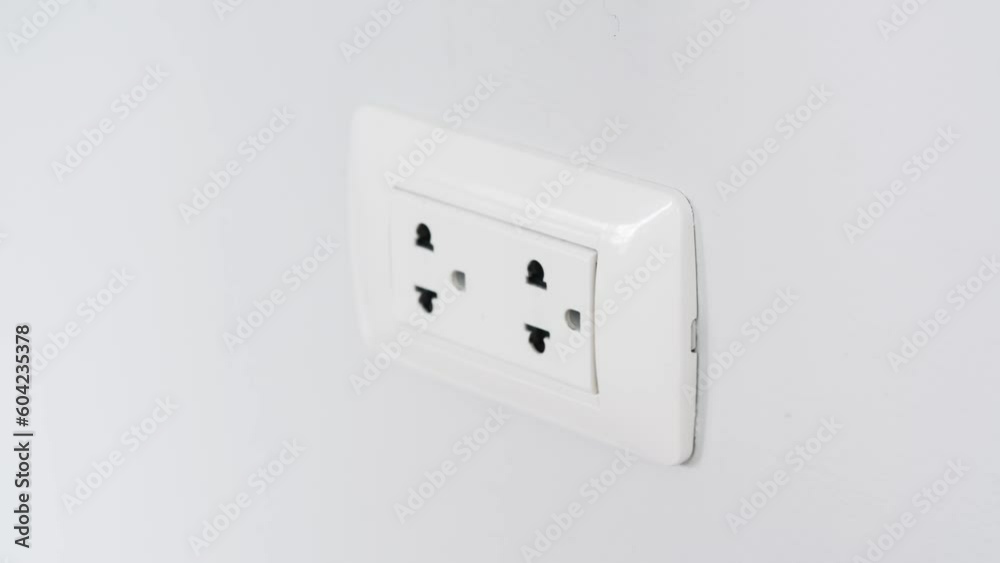 Hand of Electrical Appliances He was pulling the plug. Out of the plug. In his office during work hours. Energy Saving Concepts and Technologies	