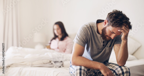 Angry couple, argument and fight on bed in disagreement, conflict or toxic relationship at home. Upset and frustrated man and woman fighting, breakup or divorce from affair or infertility in bedroom