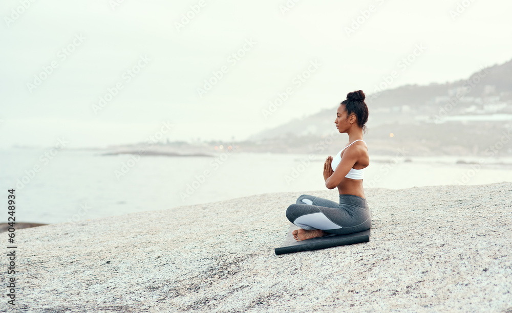 Yoga, medication and woman on a beach with lotus pose, wellness and fitness. Pilates, sea and female person on sand with peace in nature feeling relax and calm with spiritual and holistic mockup