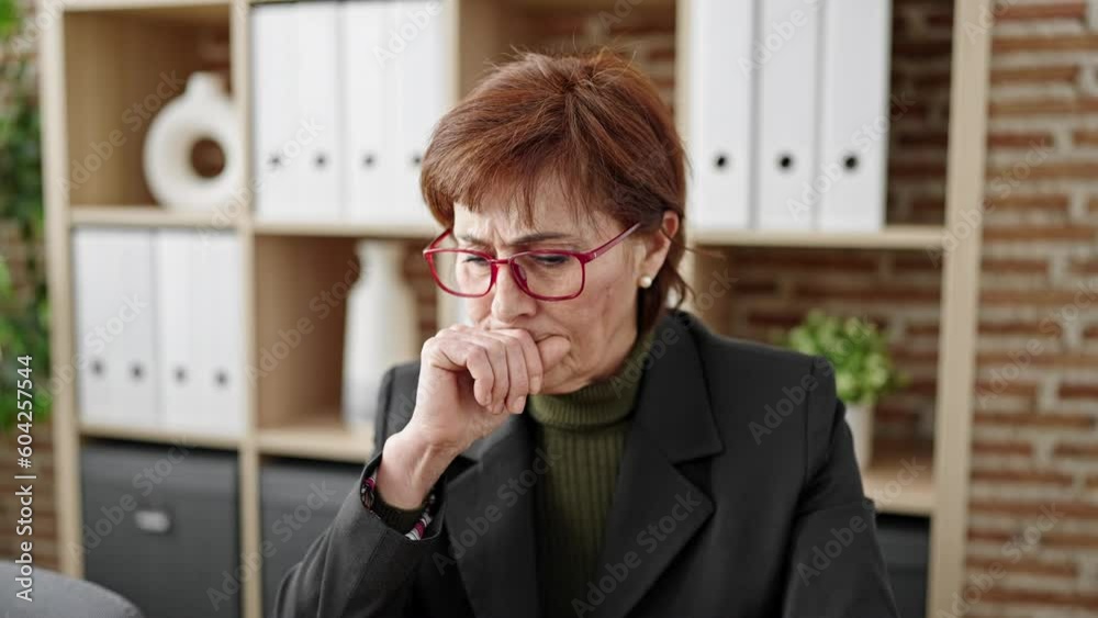 Mature hispanic woman business worker using laptop with doubt expression at office Mature hispanic woman business worker using laptop with doubt expression at office