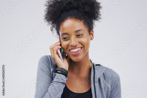 Phone call, smile and black woman speaking in studio isolated on a white background with mockup. Cellphone, happy and African female person in communication, conversation or discussion with contact.