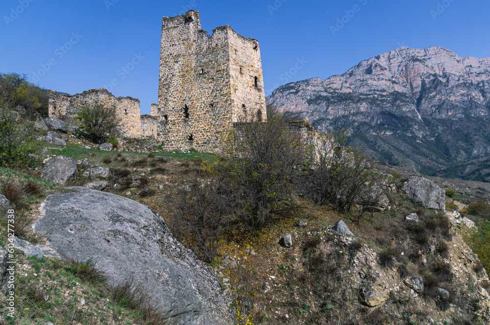 Ruins of an ancient city high in the mountains. Medieval towers built of stone to protect against attacks. A fortress for protection. The city of Egikal in Ingushetia. Battle towers with loopholes.