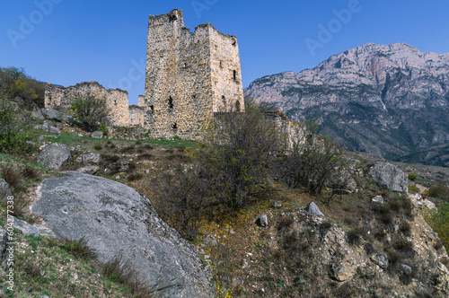 Ruins of an ancient city high in the mountains. Medieval towers built of stone to protect against attacks. A fortress for protection. The city of Egikal in Ingushetia. Battle towers with loopholes. © Eduard Belkin