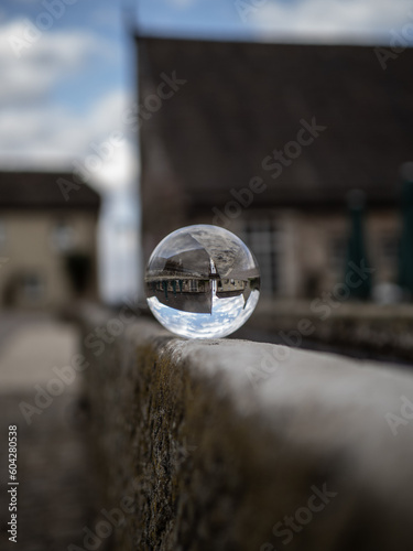 Obraz na plátně Crystal lens refractory ball in city