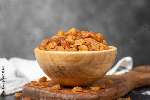 Raisins. Sun-dried grapes in wooden bowl. superfood. Vegetarian food concept. healthy snacks.