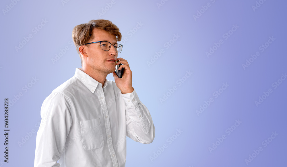 Serious businessman talking on smartphone, purple Serious businessman talking on smartphone, purple