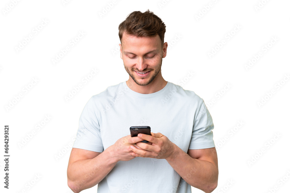Young handsome caucasian man over isolated chroma key background sending a message or email with the mobile Young handsome caucasian man over isolated chroma key background sending a message or email with the mobile