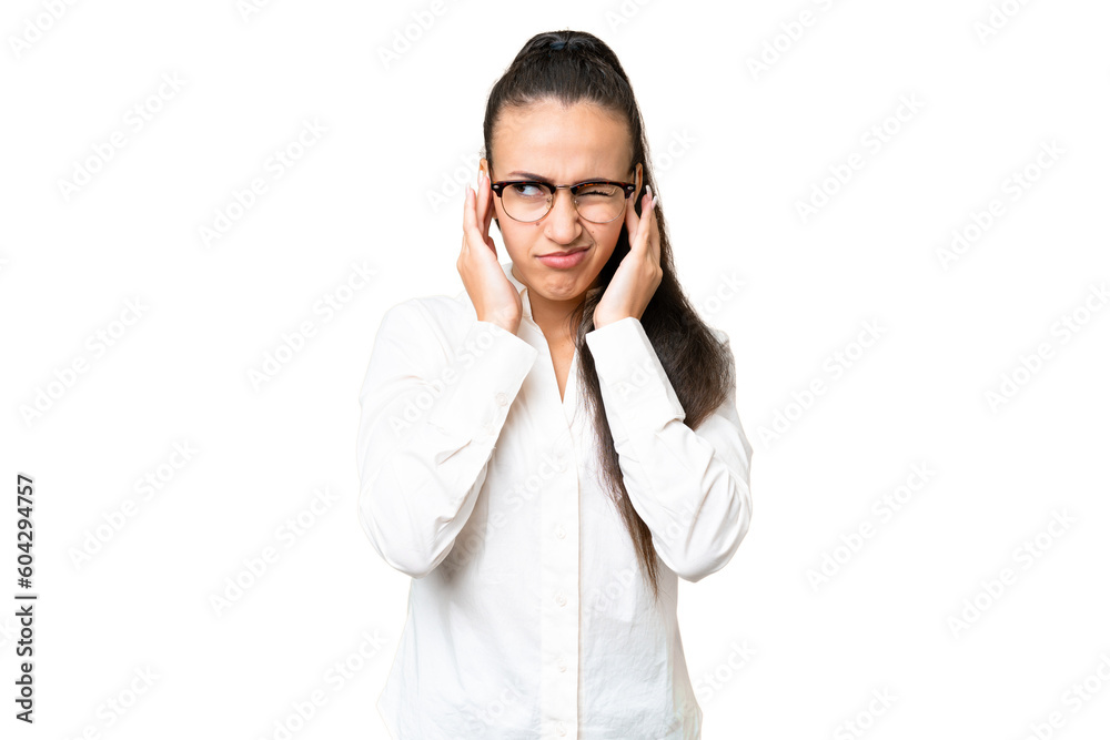Young Arabian woman over isolated chroma key background frustrated and covering ears Young Arabian woman over isolated chroma key background frustrated and covering ears