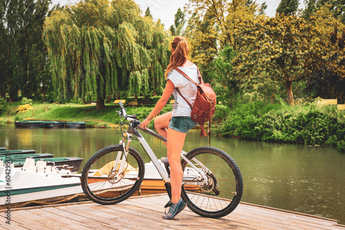 Woman tourist in bicycle in Marais Poitevin- Marshland in France- Poitou Charente photo