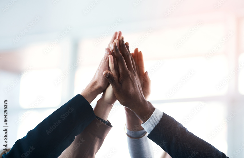 High five, colleagues and their hands together for their achievement with lens flare. Collaboration or team, group of businesspeople for support and friends with hand for cooperation or goal