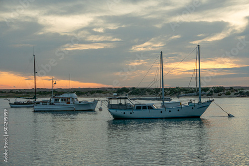 boats at sunset in the harbor
