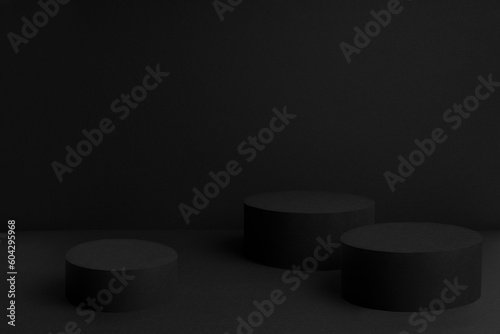Abstract black stage with three round podiums mockup for presentation cosmetic products, goods, advertising, design, showing, display, sale, text, soft gradient in beauty fashion style, copy space.
