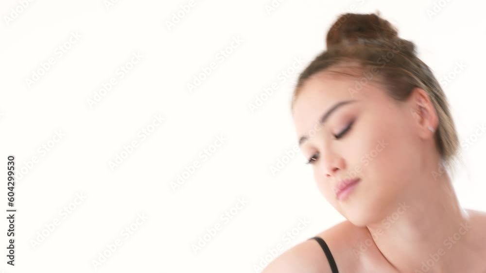 Pretty asian girl doing yoga morning exercises in white room full of sunlight. Pretty asian girl doing yoga morning exercises in white room full of sunlight.
