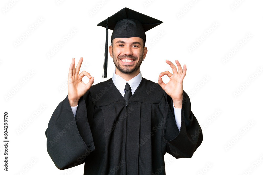 Young university graduate man over isolated chroma key background showing an ok sign with fingers Young university graduate man over isolated chroma key background showing an ok sign with fingers