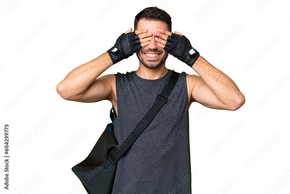 Young sport caucasian man with sport bag over over isolated chroma key background covering eyes by hands Young sport caucasian man with sport bag over over isolated chroma key background covering eyes by hands