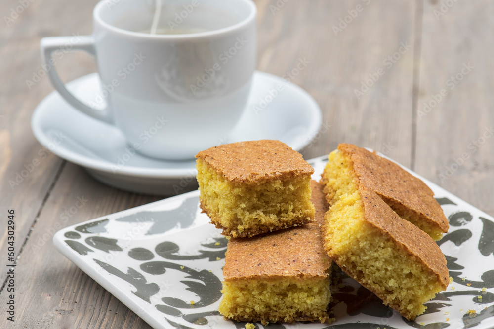 cake with semolina, turmeric served with coffee , arabian sweets of sfouf cake with semolina, turmeric served with coffee , arabian sweets of sfouf