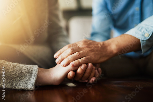 Holding hands, senior couple and life insurance support with kindness in a house. Home, love and elderly people with empathy, hope and trust with solidarity for grief care and marriage together
