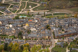 Panoramic and aerial view of the tourist village of Huesca, Benasque, made up of small brick houses with slate roofs typical of high mountain architecture, on a cloudy day.