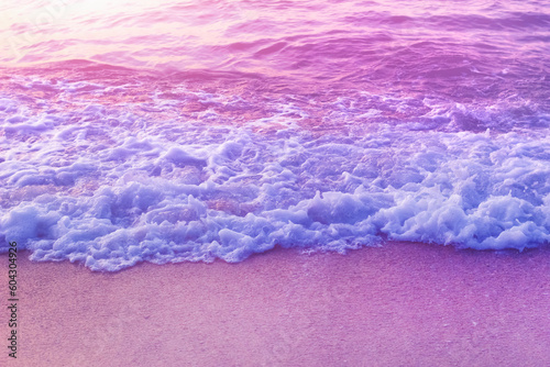 Fototapeta Naklejka Na Ścianę i Meble -  Tender dreamy pink sea waves on shore. Filtered color.