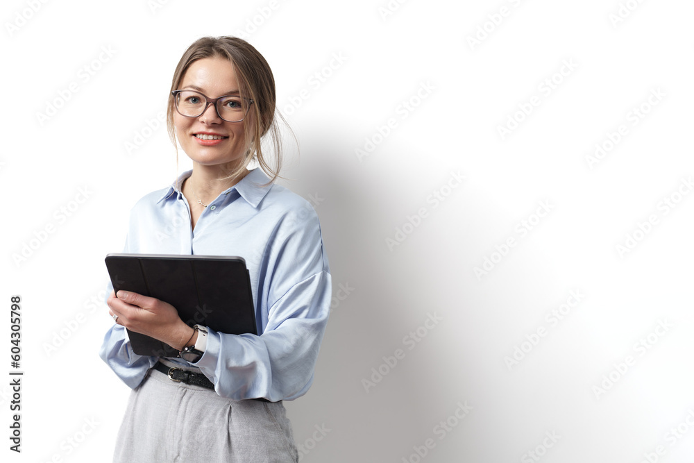Young caucasian woman wearing eyeglasses, holding digital tablet, standing over white background Young caucasian woman wearing eyeglasses, holding digital tablet, standing over white background