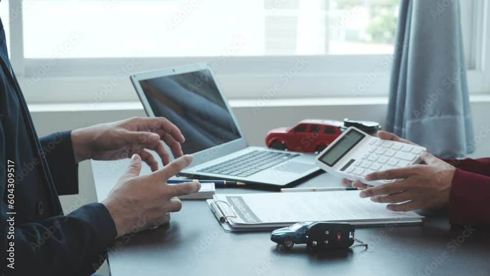 Close up meeting of business man and customer after signing car insurance document contract paper at office, car rental or buy.