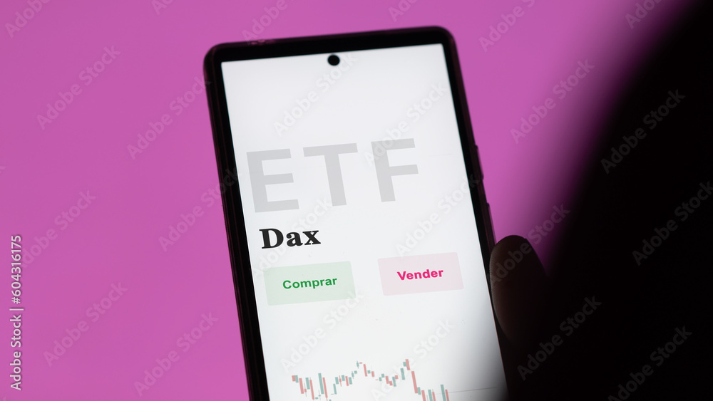 March 2023, An investor analyzing an etf fund. ETF text in Spanish : DAX, buy, sell. March 2023, An investor analyzing an etf fund. ETF text in Spanish : DAX, buy, sell.