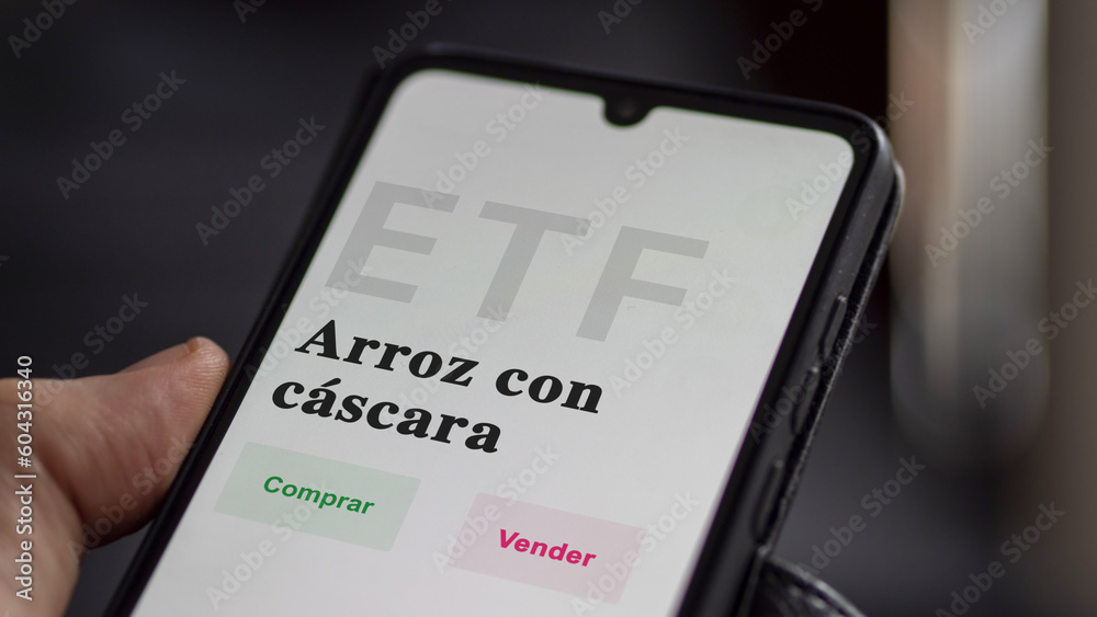 An investor analyzing an etf fund. ETF text in Spanish : rough Rice, buy, sell. An investor analyzing an etf fund. ETF text in Spanish : rough Rice, buy, sell.