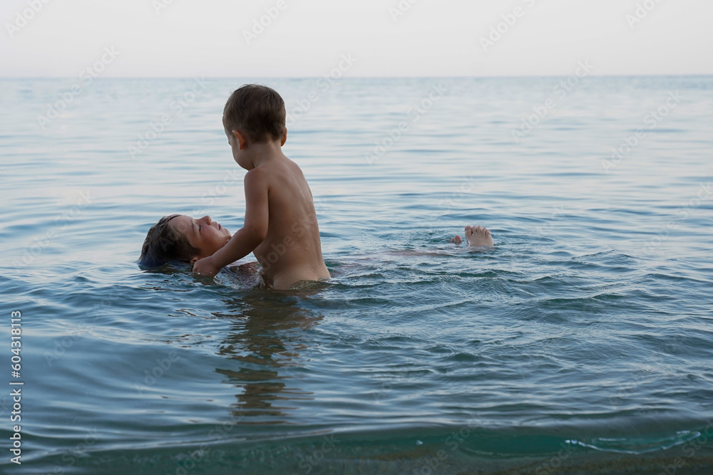 A little boy is a lifeguard. Children's safety in the water.