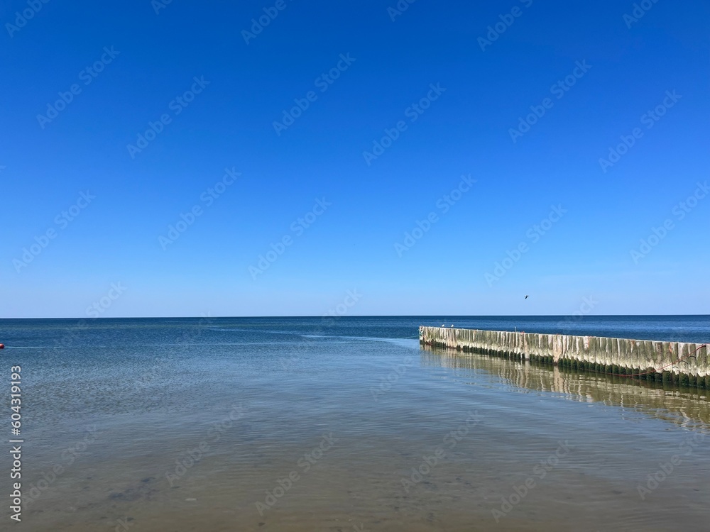 Transparent sea water, blue sea horizon, blue sky 