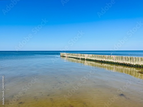 Transparent sea water, blue sea horizon, blue sky 