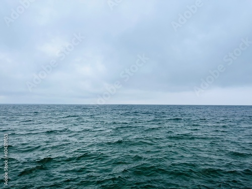 Cloudy gray seascape, sea coast, windy cloudy weather 