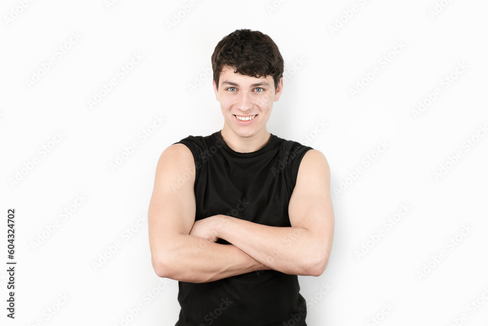 A handsome boy still a teenager with a good charismatic appearance and an athletic body is smiling and sincerely happy about his success in life and studying in college, a charming guy smile A handsome boy still a teenager with a good charismatic appearance and an athletic body is smiling and sincerely happy about his success in life and studying in college, a charming guy smile