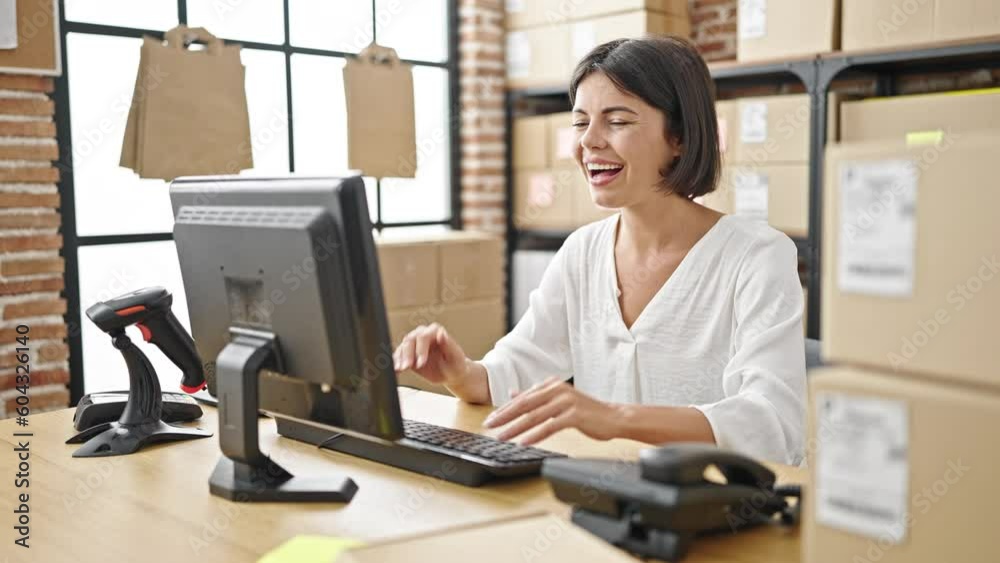 Young beautiful hispanic woman ecommerce business worker using computer with winner expression at office