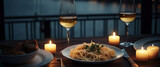 A plate of pasta and wine on a table with a view of the water and a bridge in the background. Generative AI