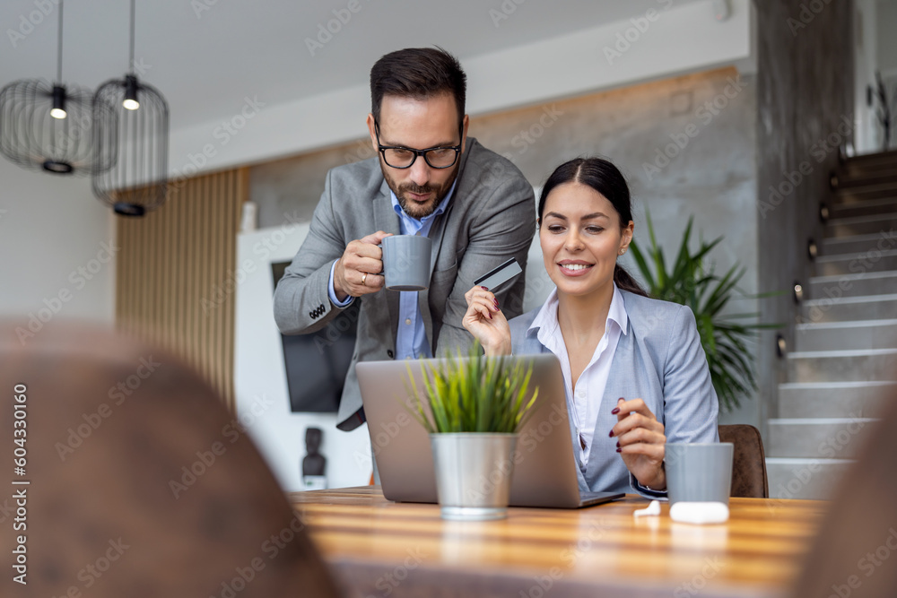 Two coworkers at the office discuss about business strategy of new investments Two coworkers at the office discuss about business strategy of new investments