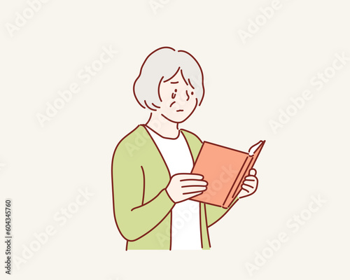  Old woman crying reading a book. Hand drawn style vector design illustrations.