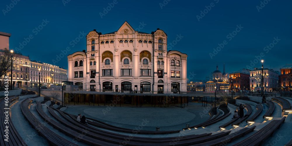 Night panoramic cityscape Russian style facade of Polytechnic Museum building and park bench, Moscow