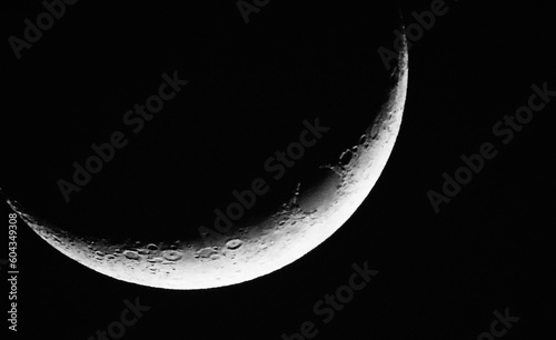 Close-up of a crescent moon on a cold evening in march with a black background.
