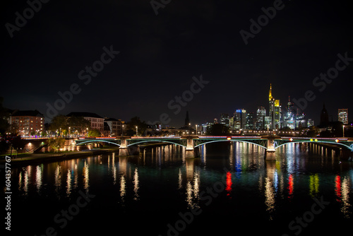  Night  of Frankfurt  Germany with river  bridge  traffic  city illumination reflected in water  and downtown skyline with skyscrapers in autumn. 