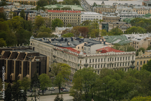 Aerial view of a residential district in an ancient city, filled with bustling crowds and awe-inspiring architecture of Riga
