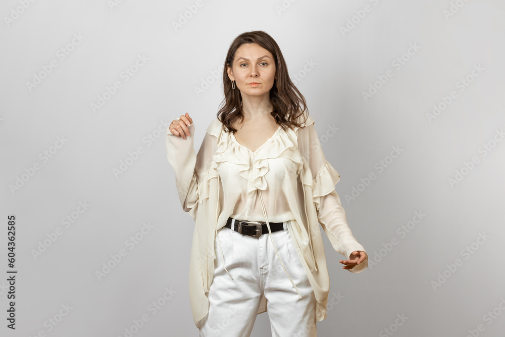 Woman Wearing White Jeans and Blouse with Frills Woman Wearing White Jeans and Blouse with Frills