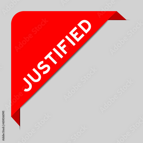 Red color of corner label banner with word justified on gray background