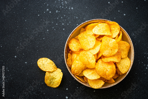 Chips on black stone table. Top view.