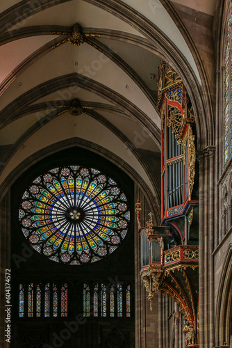 Rosette stained glass window by the interior of famous Notre Dame Cathedral de Strasbourg  France